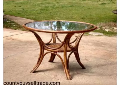 round wicker table with glass